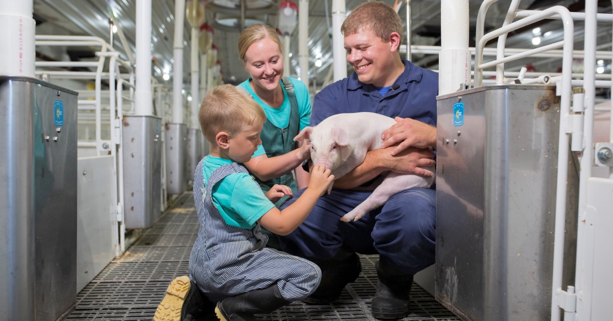 Dr. Bents with family and baby pig